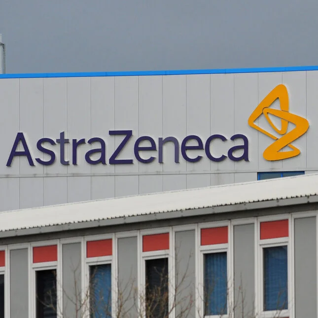 A building with AstraZeneca's logo under gray sky